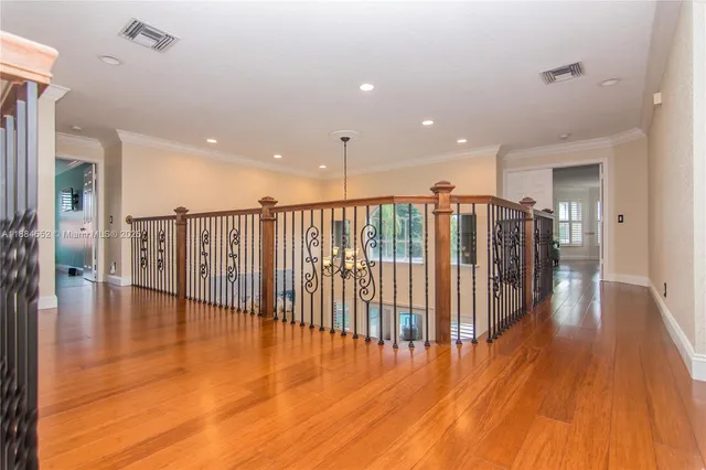 a view of a living room and wooden floor