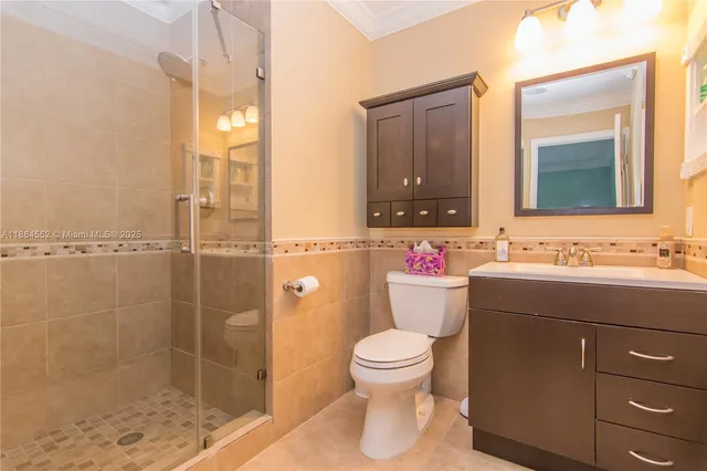a view of a room with wooden floor and windows
