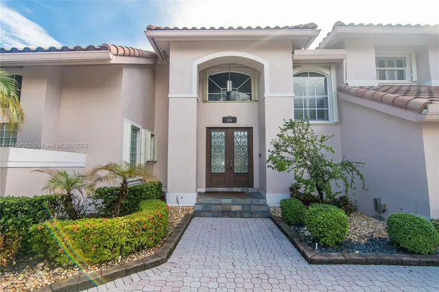 a front view of a house with garden