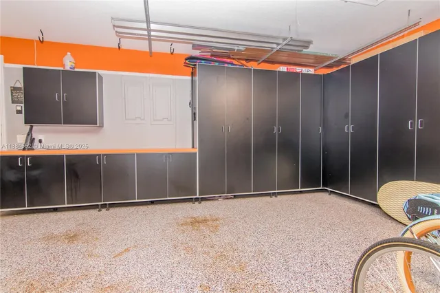 a view of an empty room with a fireplace and a large window