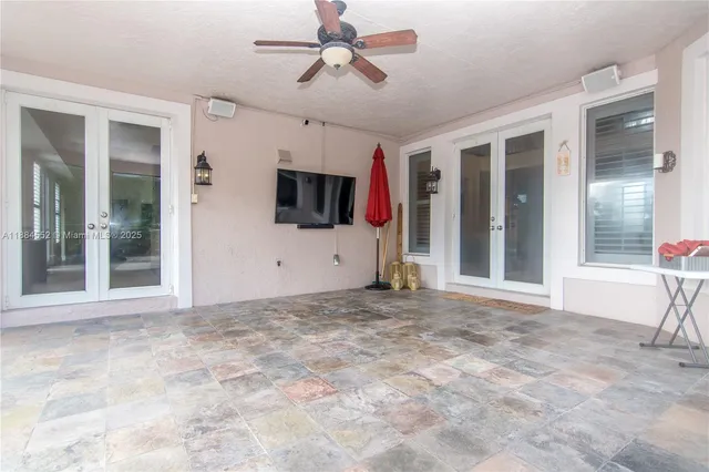 a view of an empty room with floor to ceiling windows and floor to ceiling window