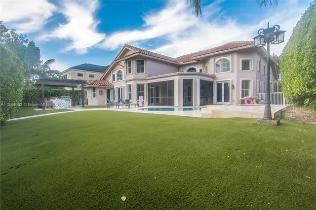 a front view of a house with a garden area