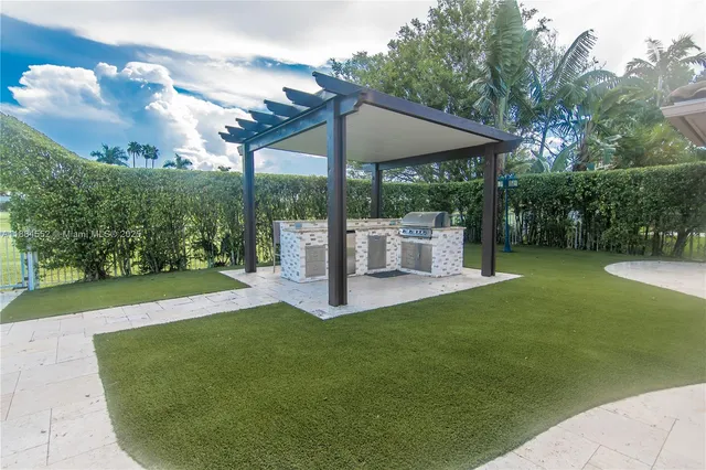 a view of a patio with a stove back yard
