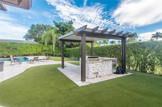 a view of a chair and tables in the patio