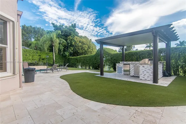 a view of a swimming pool with a yard