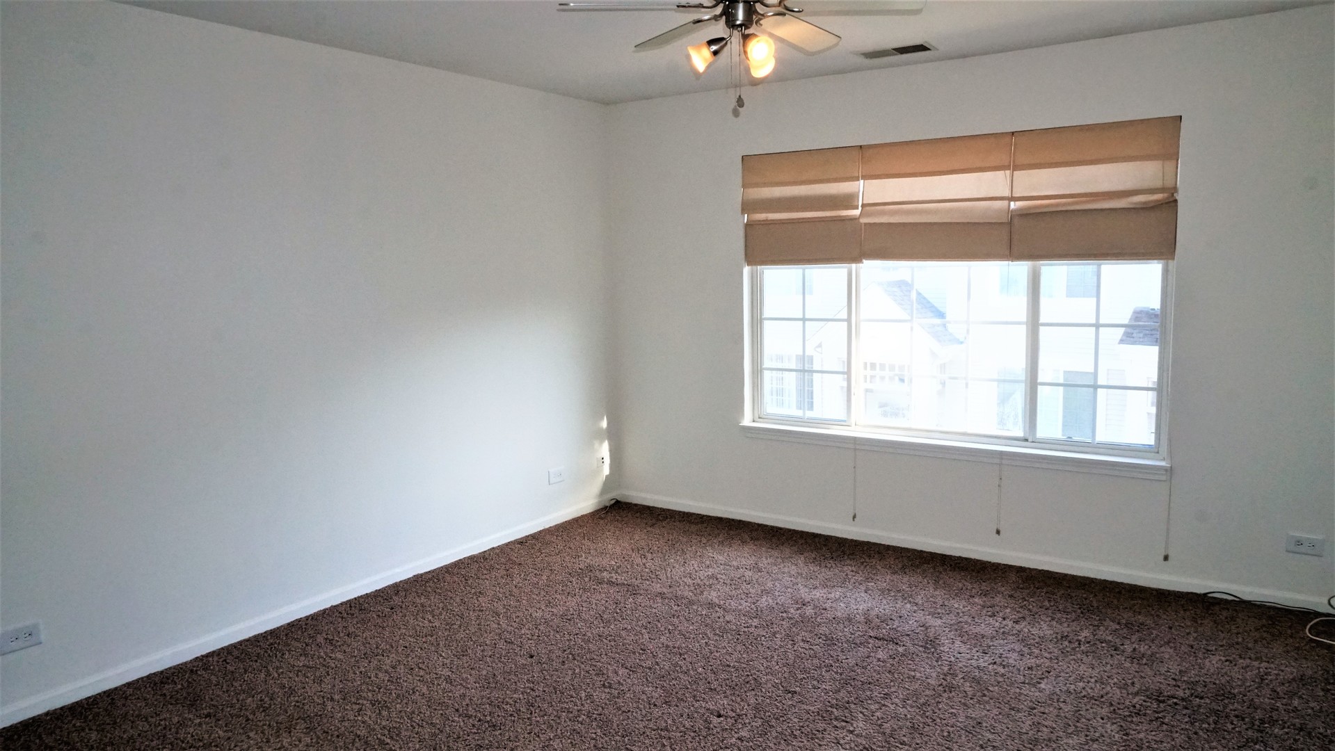 3360 Ravinia Circle Aurora, IL 60504 - Photo 14 of 32 an empty room with a window