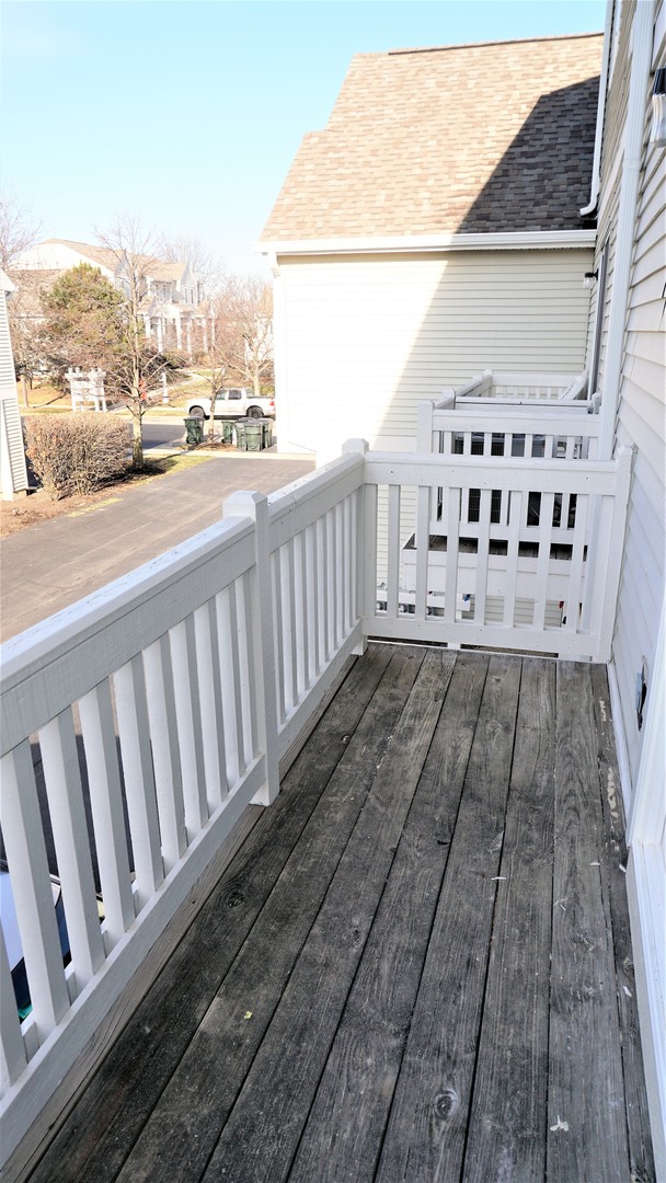 3360 Ravinia Circle Aurora, IL 60504 - Photo 31 of 32 a view of a balcony with wooden floor