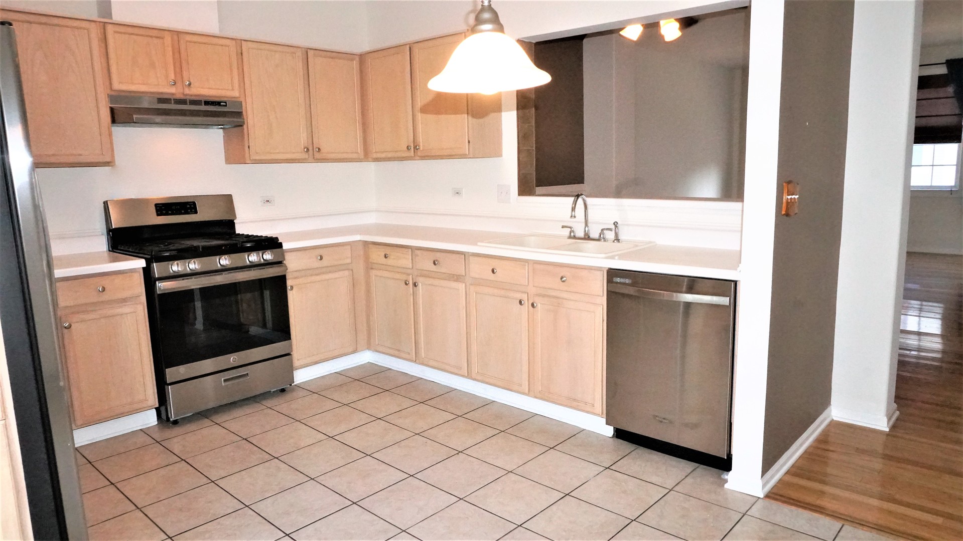 3360 Ravinia Circle Aurora, IL 60504 - Photo 6 of 32 a kitchen with a sink stove and cabinets