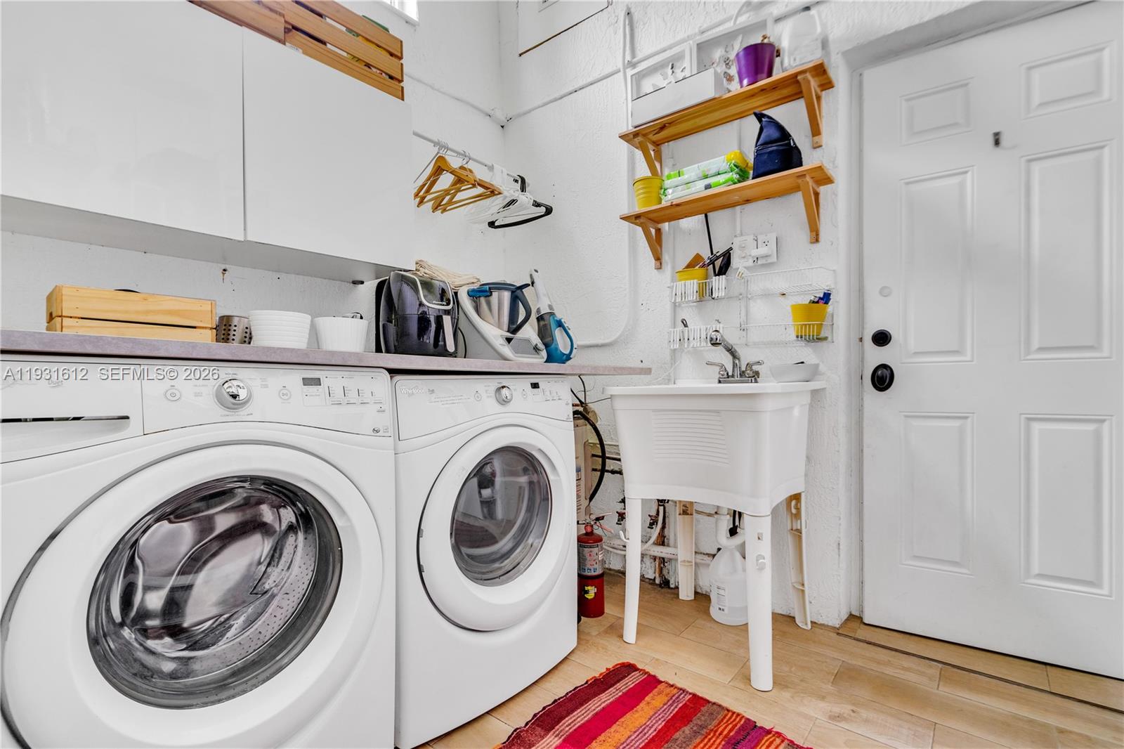 419 Southwest 30th Road Miami, FL 33129 - Photo 16 of 22 a utility room with dryer and washer