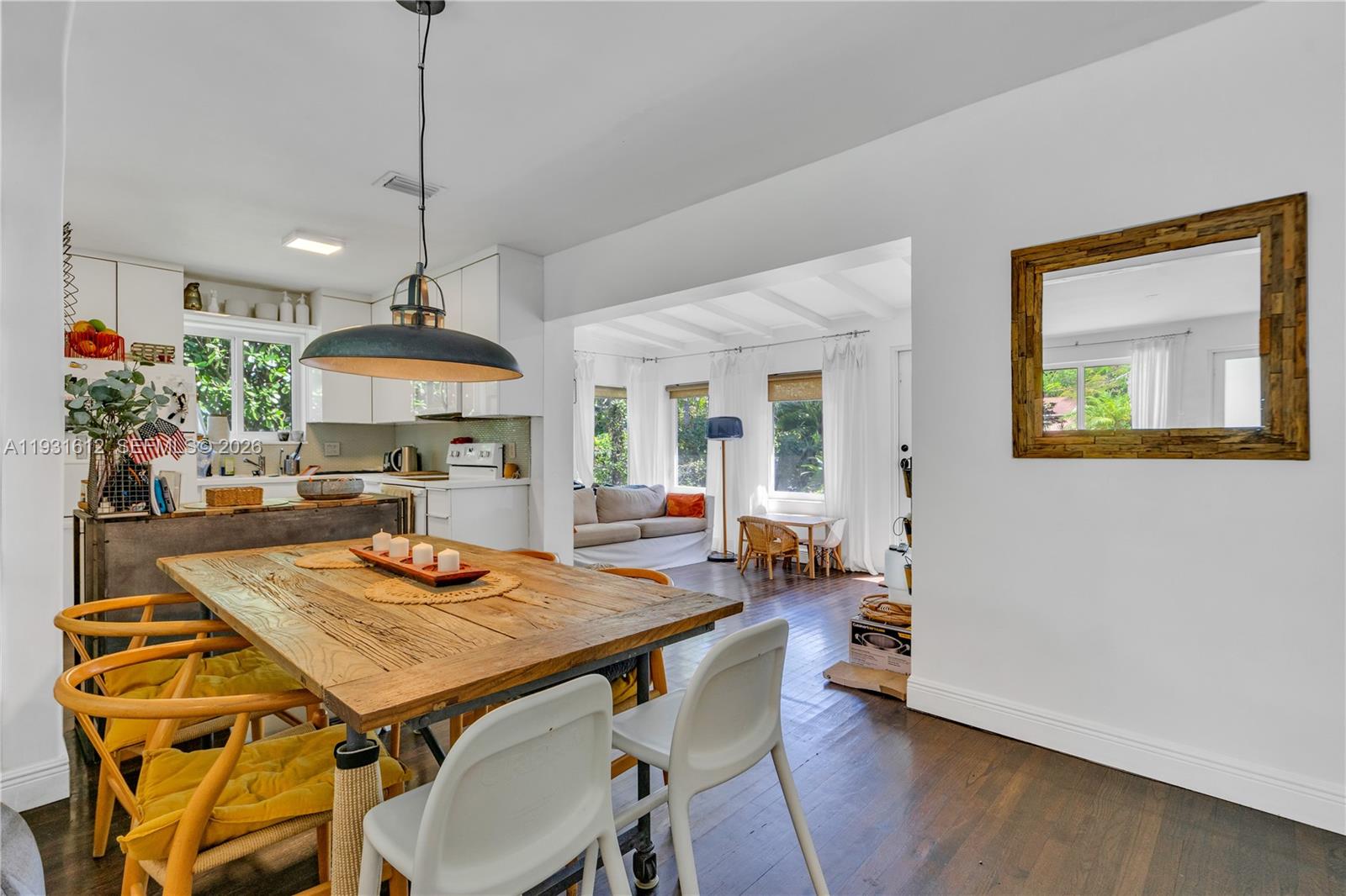 419 Southwest 30th Road Miami, FL 33129 - Photo 6 of 22 a view of a dining room with furniture window and wooden floor