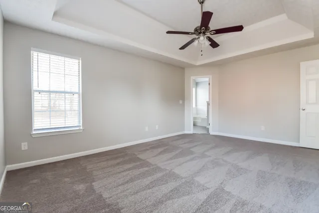 a view of room with a ceiling fan