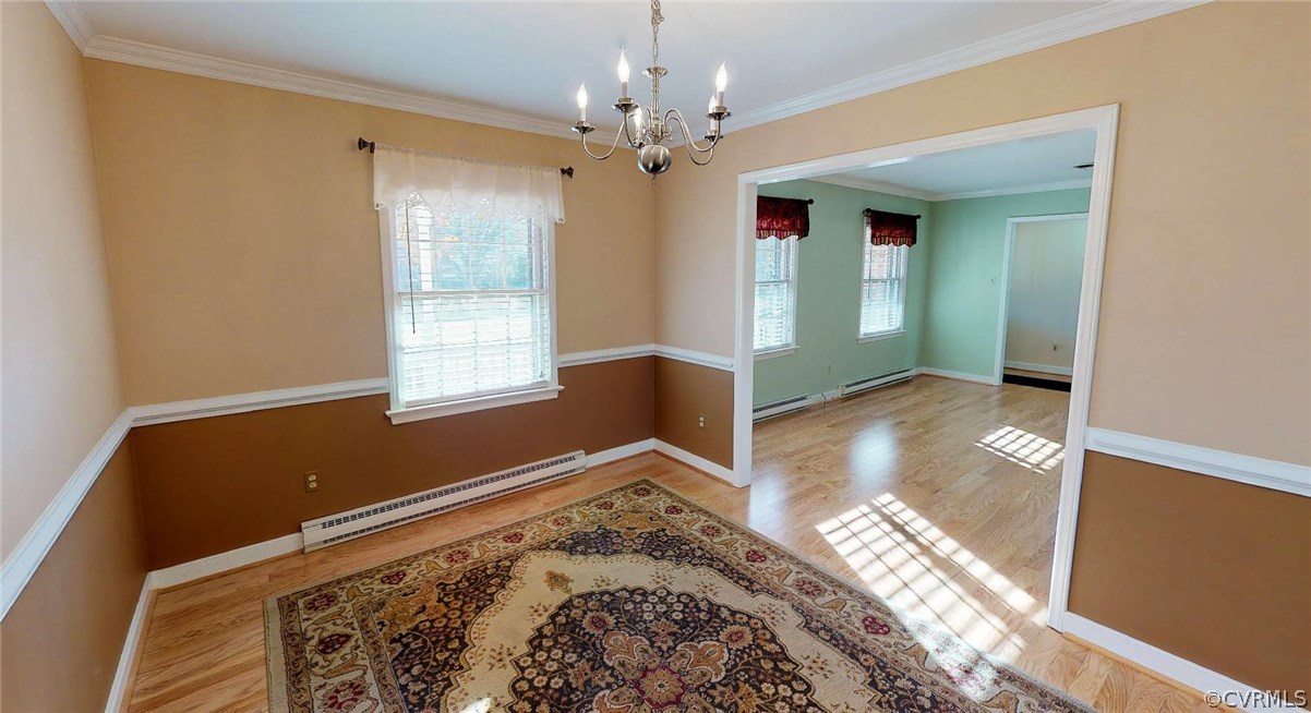 4210 Cresthill Road Chester, VA 23831 - Photo 17 of 37 a view of a livingroom with wooden floor and a ceiling fan