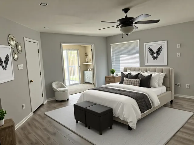 a spacious bedroom with a bed and wooden floor