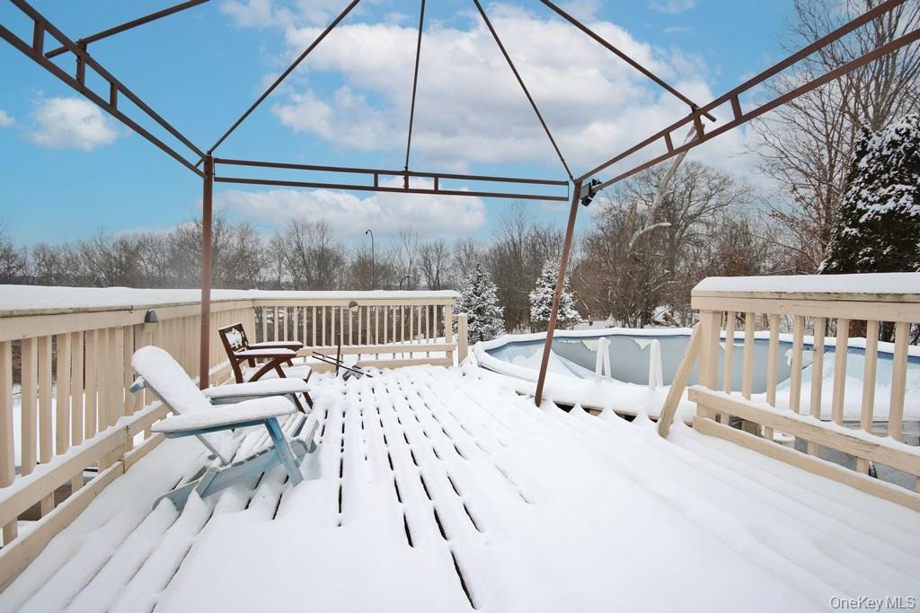 1065 Dolsontown Road Middletown, NY 10940 - Photo 14 of 50 a view of a chair and tables in the balcony