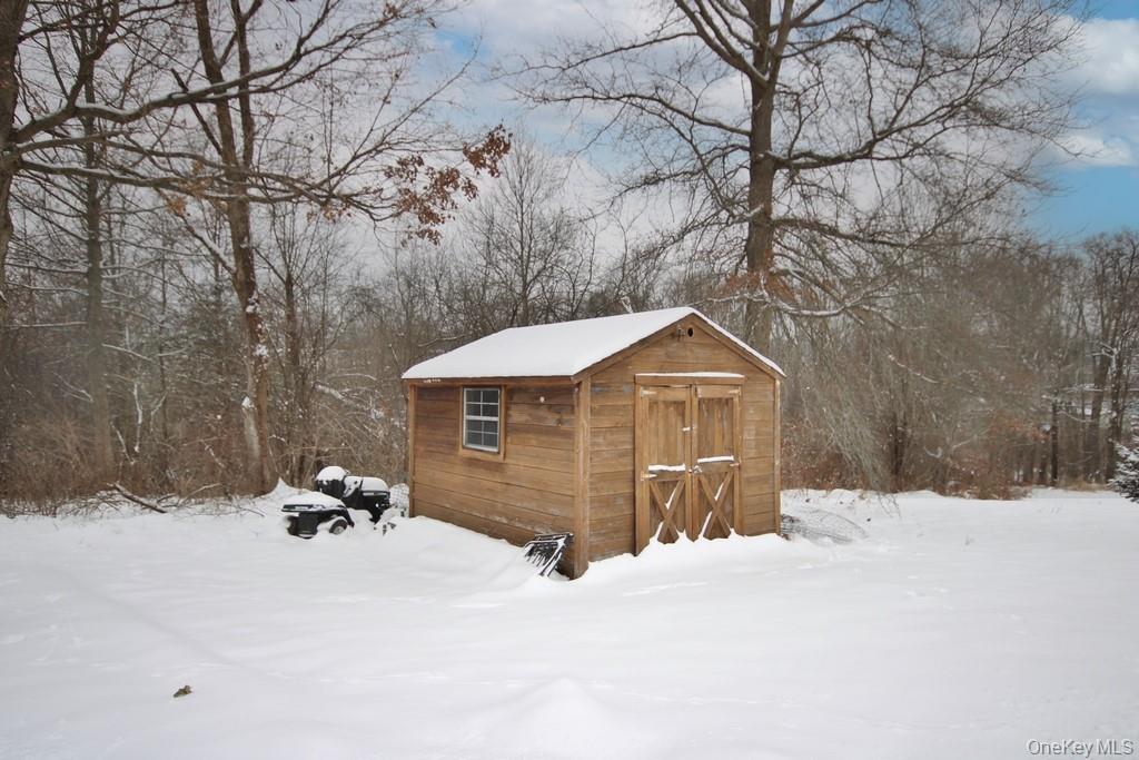 1065 Dolsontown Road Middletown, NY 10940 - Photo 17 of 50 a view of a house with a yard covered in snow