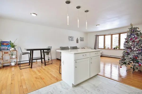 a kitchen with a sink window and cabinets