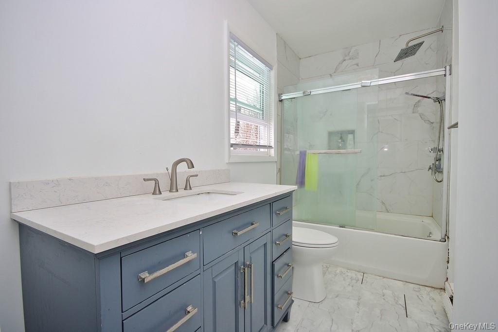 1065 Dolsontown Road Middletown, NY 10940 - Photo 38 of 50 a bathroom with a sink toilet and shower