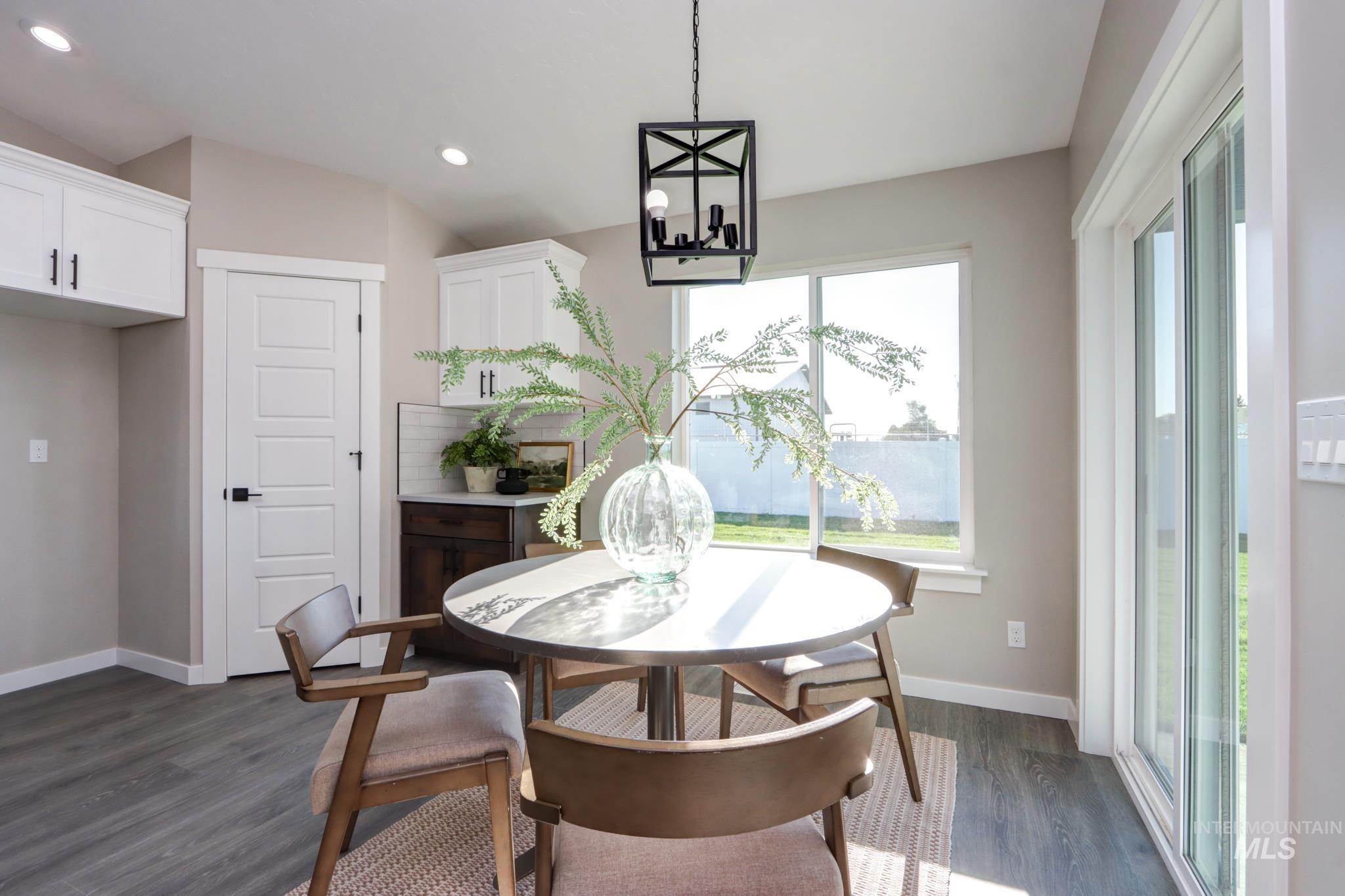 848 North 5th Street Nyssa, OR 97913 - Photo 10 of 49 Dining area featuring wood-finish flooring and neutral wall tones