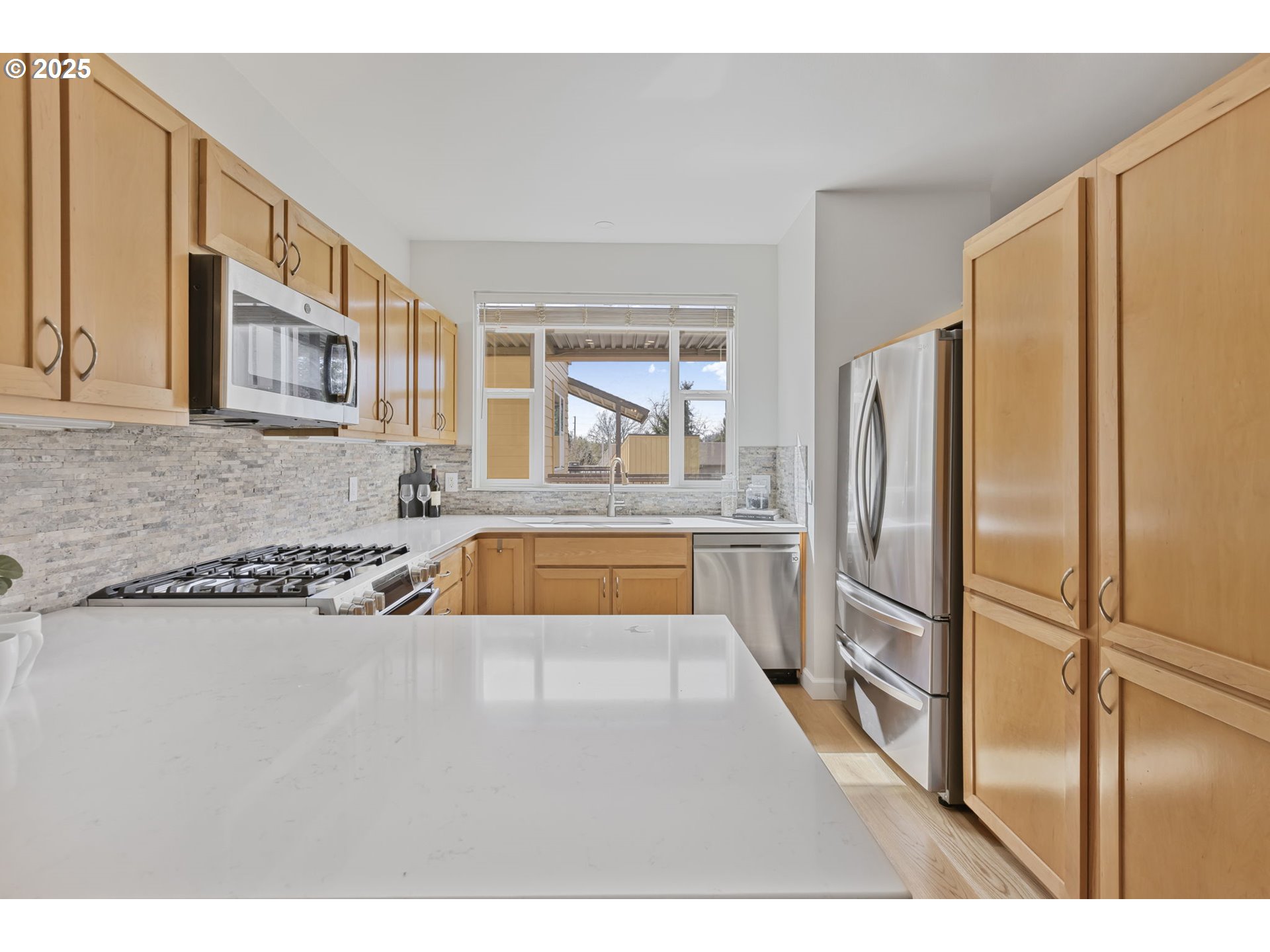 347 Rustic Place, Unit 24 Eugene, OR 97401 - Photo 14 of 42 a kitchen with stainless steel appliances granite countertop a refrigerator a oven and a sink with granite countertops