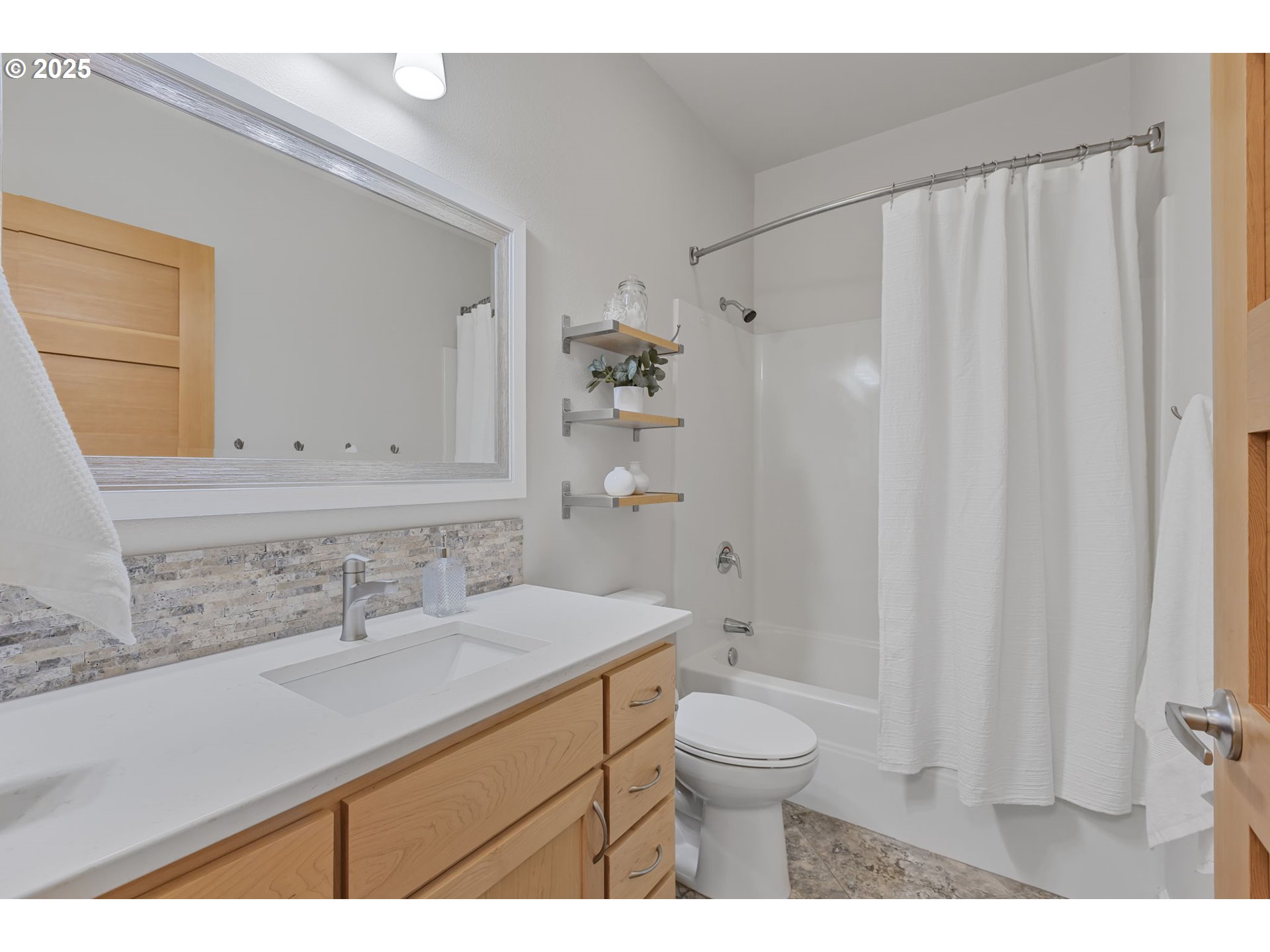 347 Rustic Place, Unit 24 Eugene, OR 97401 - Photo 33 of 42 a bathroom with a sink a toilet and a mirror
