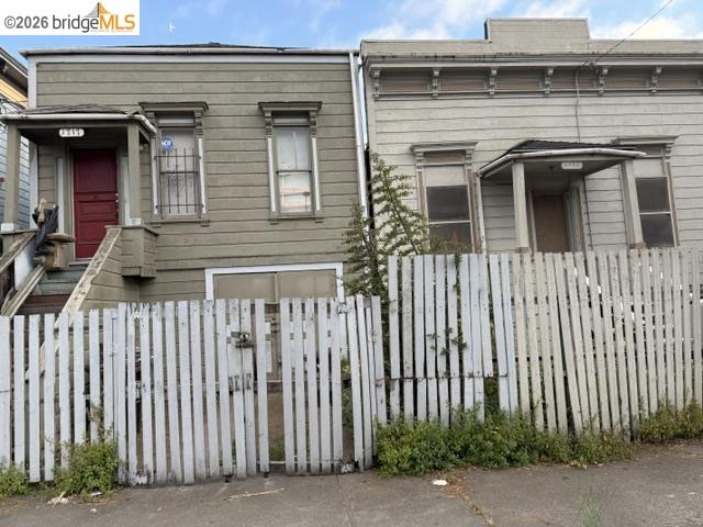 1717 9th Street Oakland, CA 94607 - Photo 1 of 4 Traditional facade featuring horizontal siding and decorative window trim