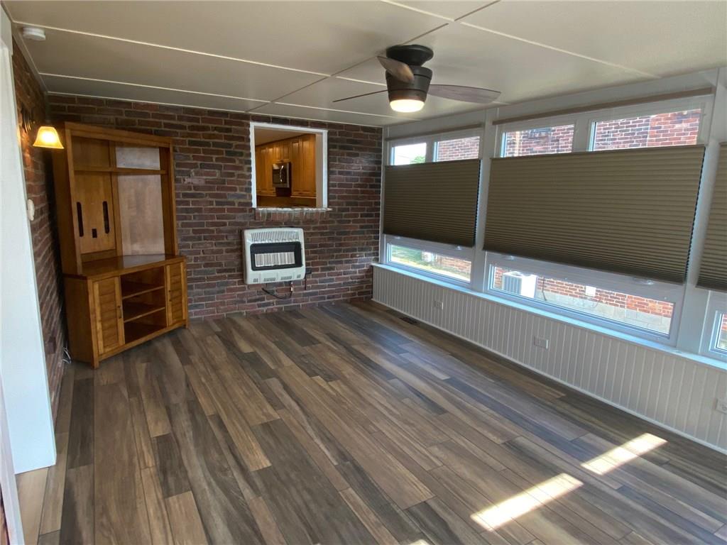 856 Rolling Rock Road Pittsburgh, PA 15234 - Photo 10 of 24 1st Floor Family room with was mounted gas heater