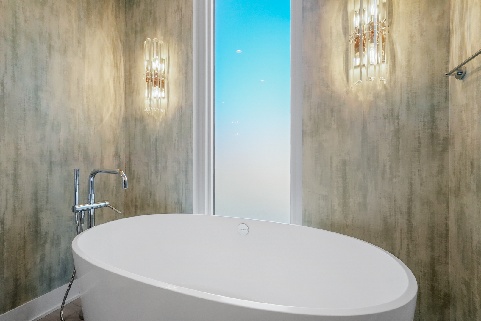 360 West Erie Street, Unit 3D Chicago, IL 60654 - Photo 31 of 52 a white tub sitting next to a bathroom sink