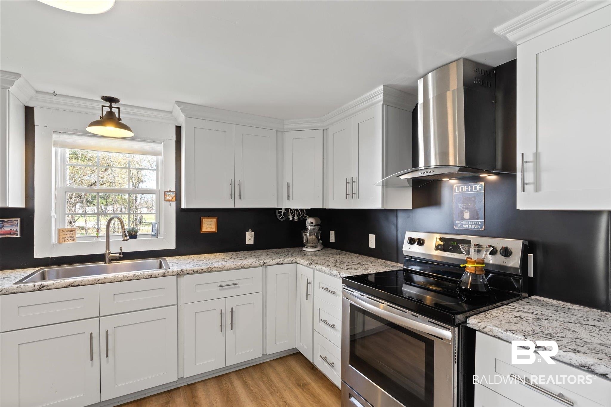 14280 Cat Deakle Road Grand Bay, AL 36541 - Photo 12 of 51 Kitchen with white cabinetry, stainless steel electric range oven, wall chimney range hood, and a sink
