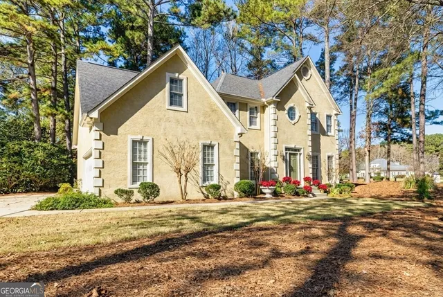 a view of a chairs and table on the wooden deck