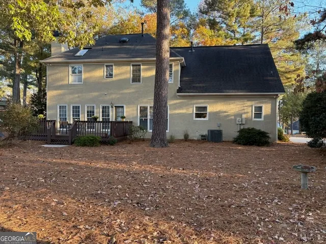 a view of a room with wooden floor windows and stairs
