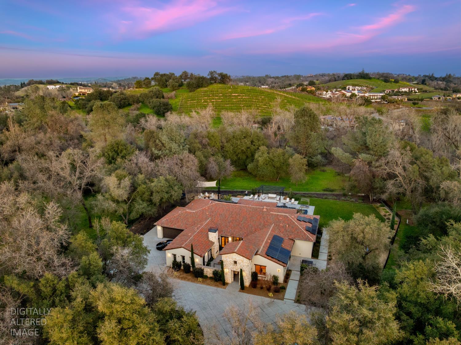 an aerial view of a house with a lake view