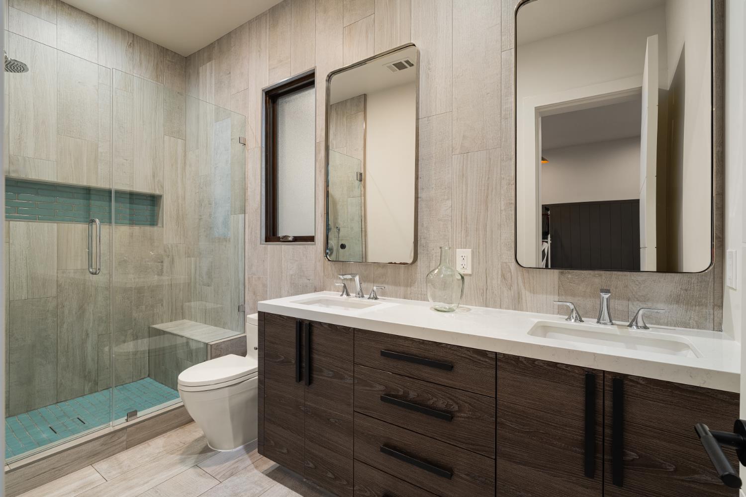 5331 Barton Road Loomis, CA 95650 - Photo 44 of 93 a bathroom with a double vanity sink toilet and shower