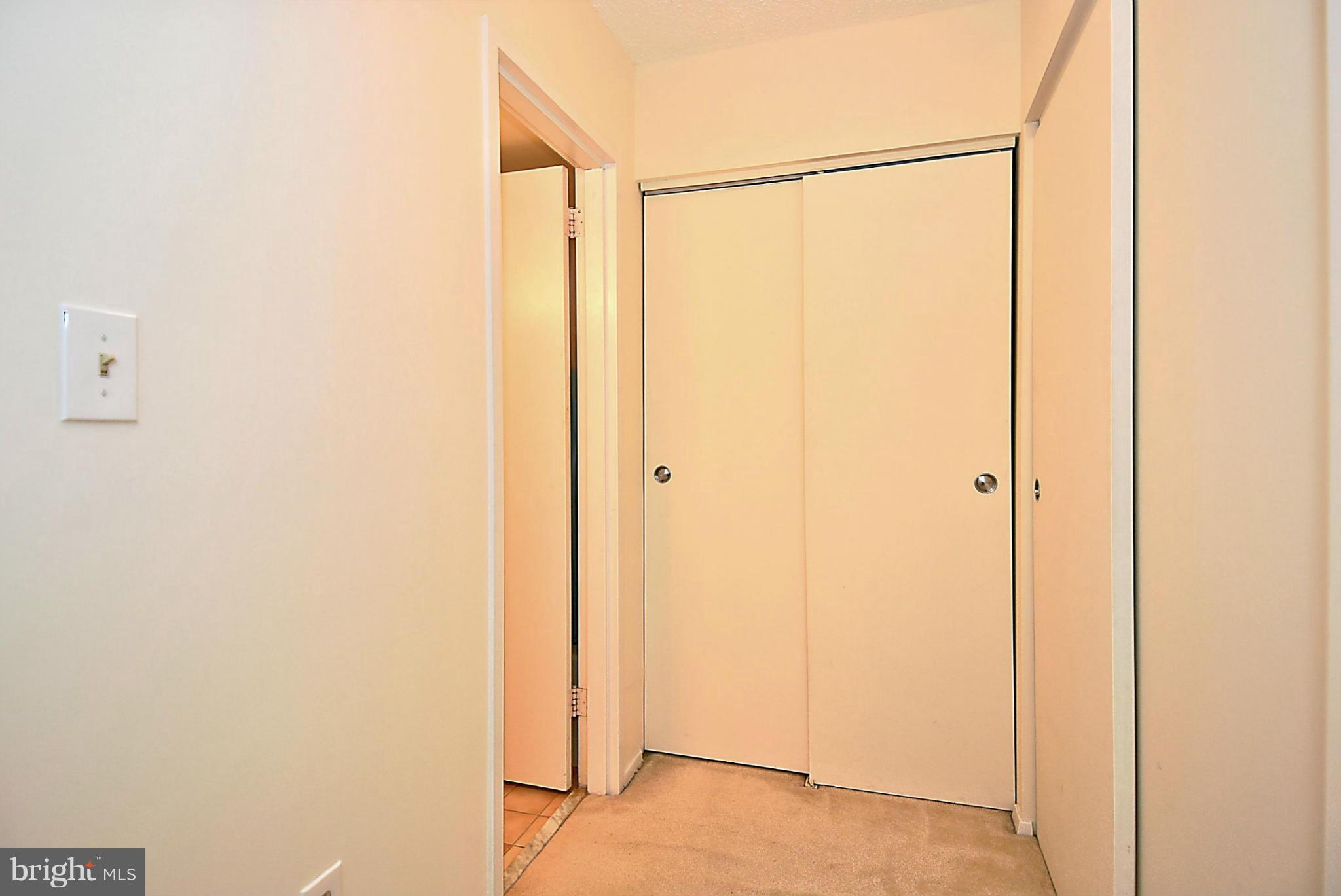 1808 Old Meadow Road, Unit 217 McLean, VA 22102 - Photo 12 of 30 a bathroom with a glass shower door