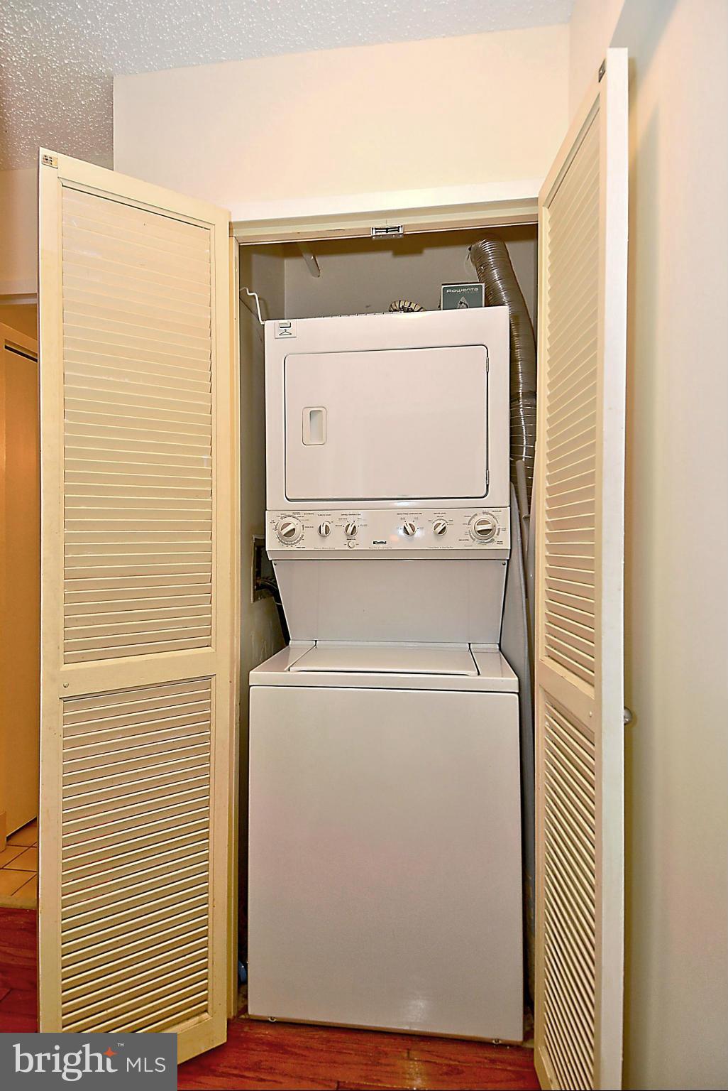 1808 Old Meadow Road, Unit 217 McLean, VA 22102 - Photo 15 of 30 a utility room with dryer and washer