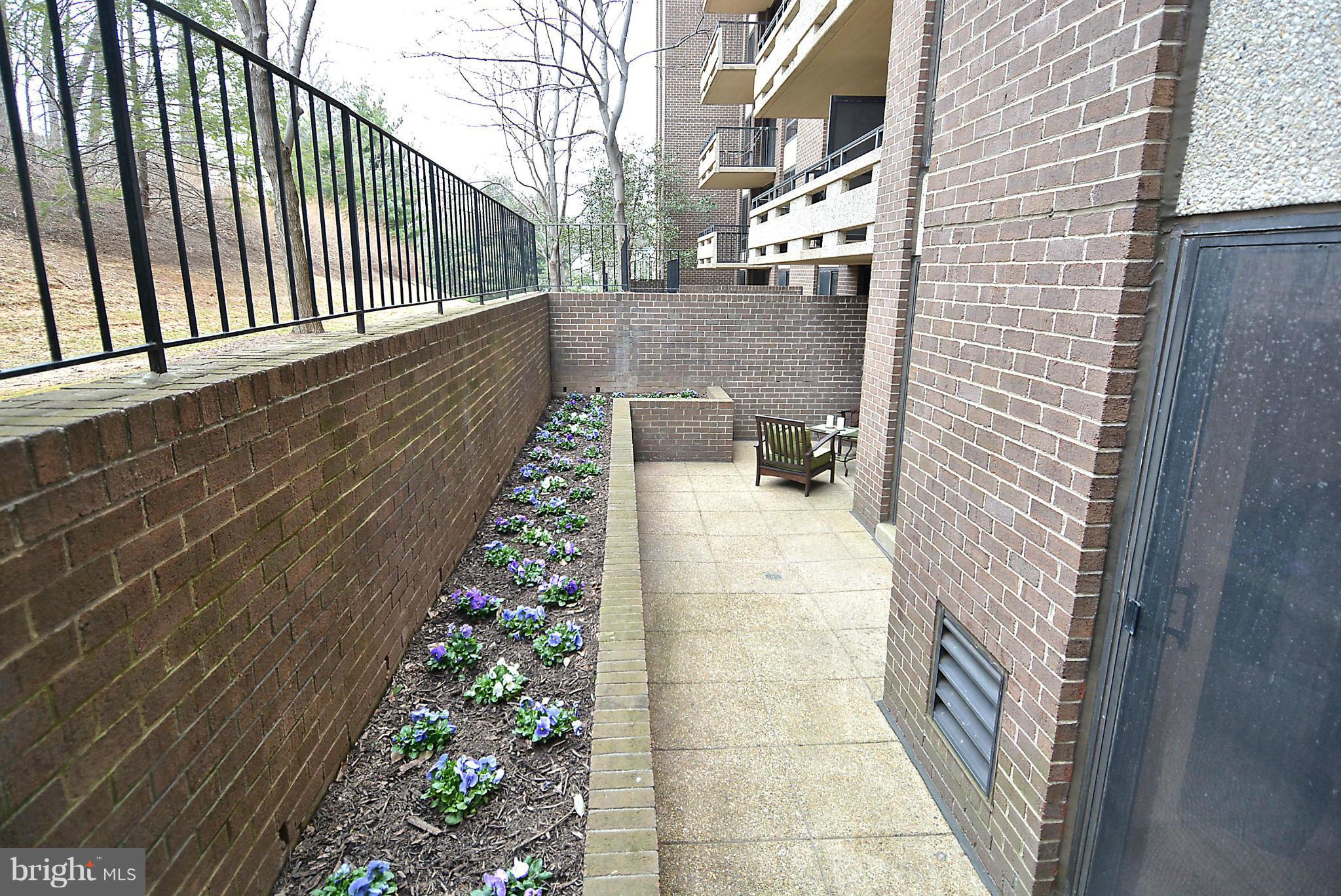 1808 Old Meadow Road, Unit 217 McLean, VA 22102 - Photo 20 of 30 a balcony view with hardwood floor