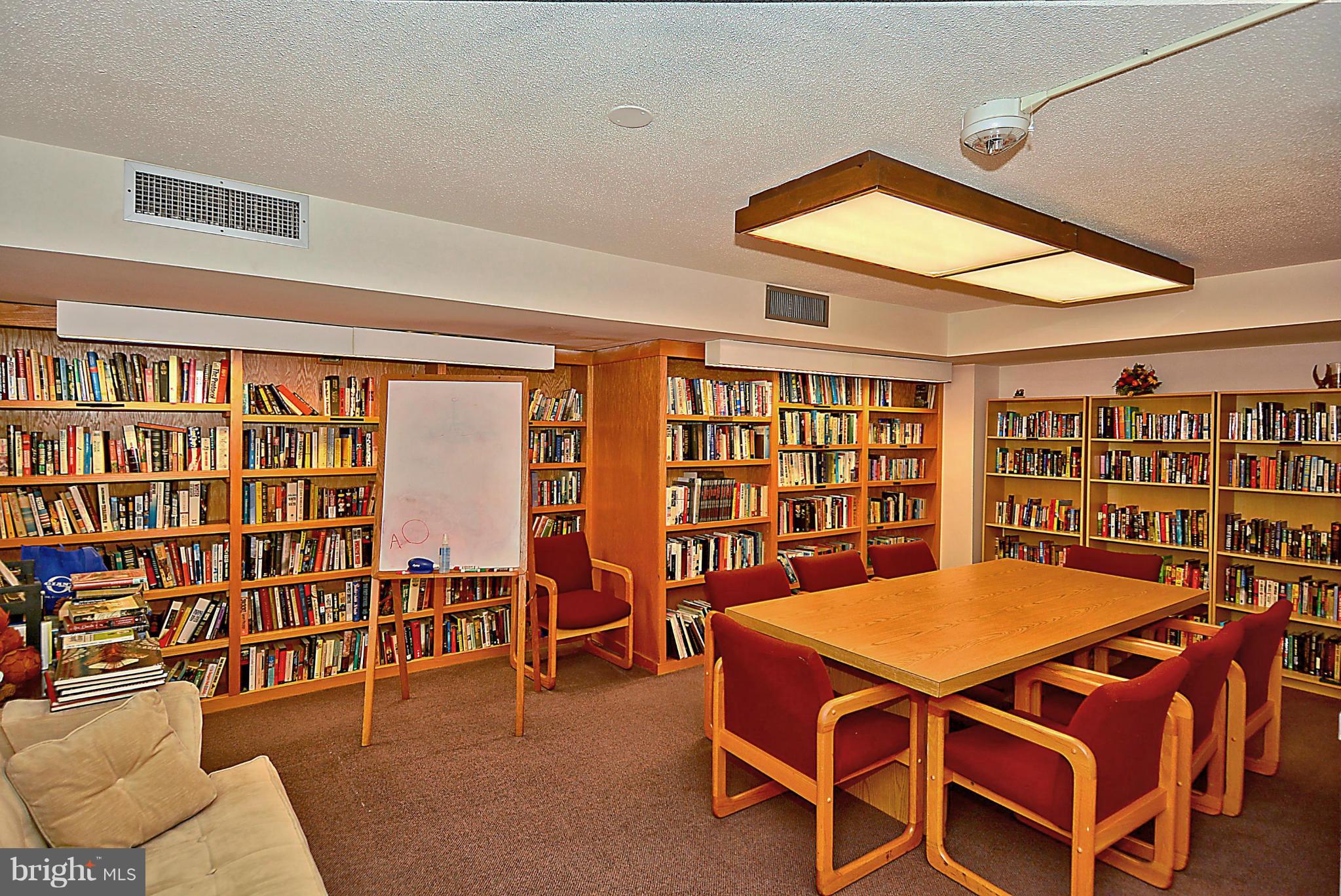 1808 Old Meadow Road, Unit 217 McLean, VA 22102 - Photo 27 of 30 a view of a livingroom with furniture and dining room