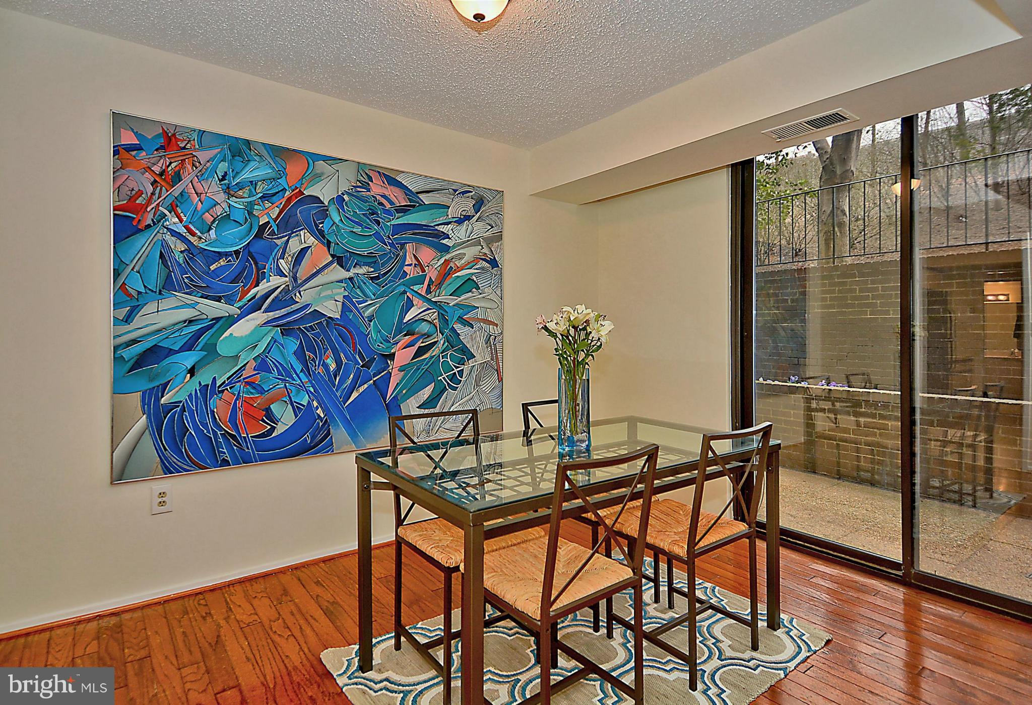 1808 Old Meadow Road, Unit 217 McLean, VA 22102 - Photo 5 of 30 a view of a workspace with furniture and wooden floor