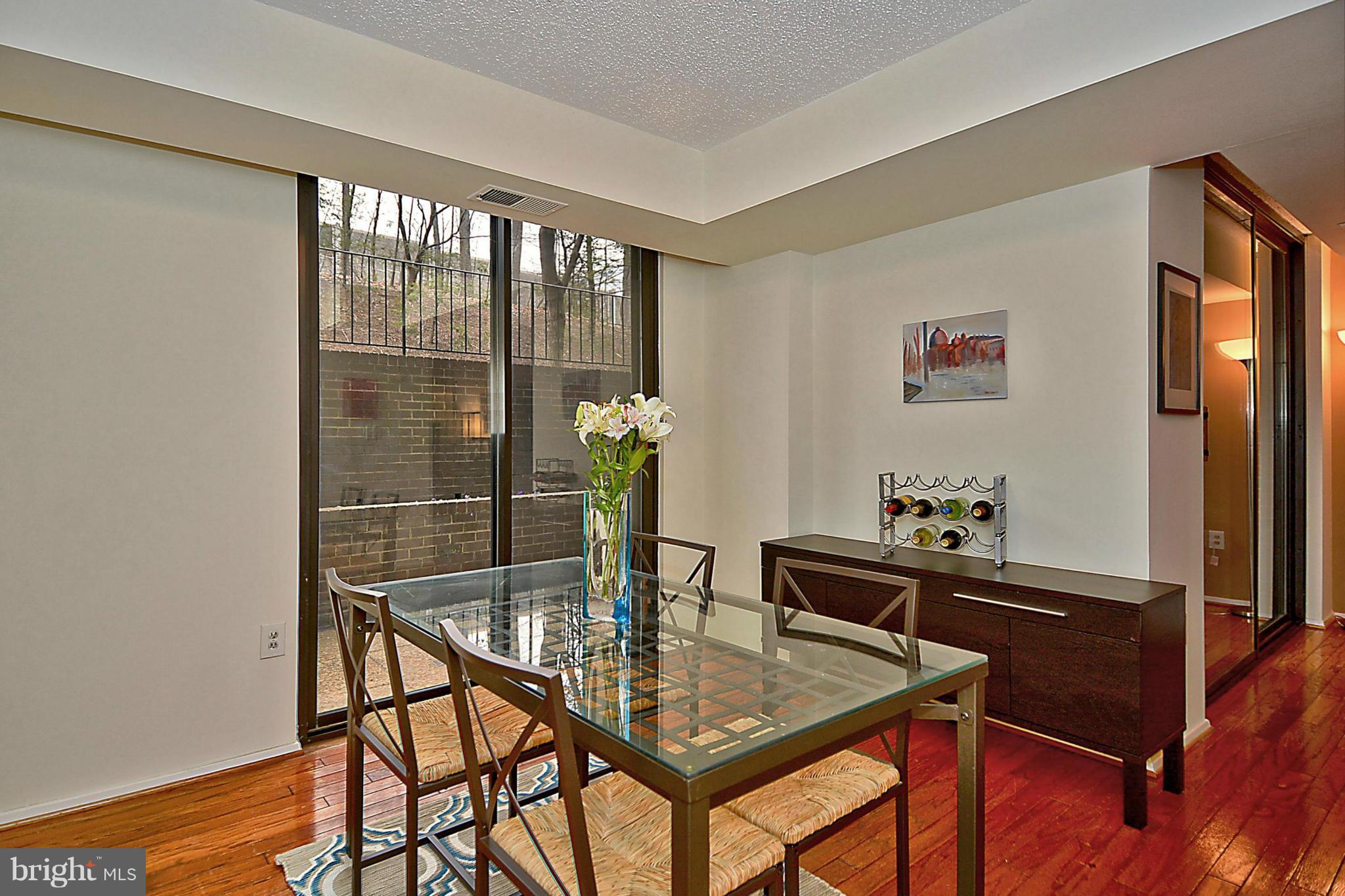 1808 Old Meadow Road, Unit 217 McLean, VA 22102 - Photo 6 of 30 a dining room with furniture and window