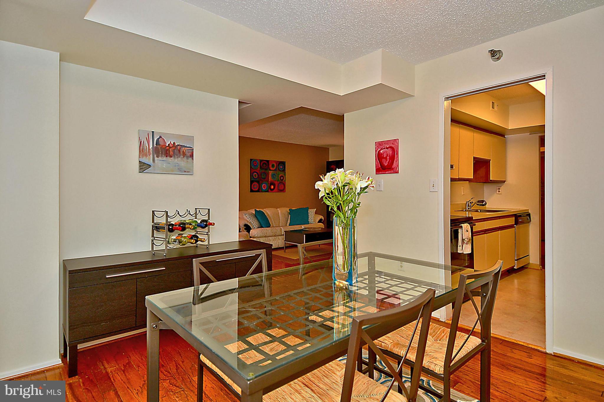 1808 Old Meadow Road, Unit 217 McLean, VA 22102 - Photo 7 of 30 a living room with furniture and flowers