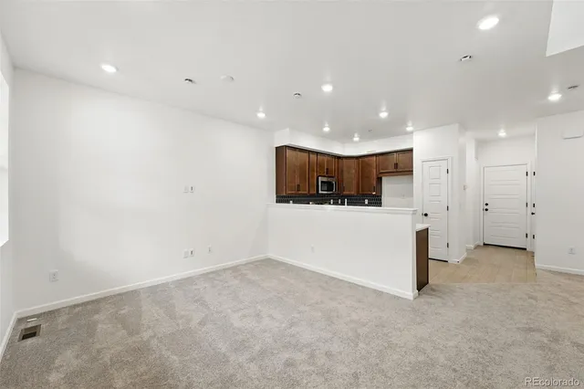 a kitchen with a sink stove and microwave