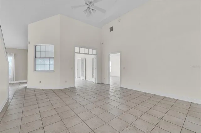 a kitchen with kitchen island a counter top space stainless steel appliances and cabinets