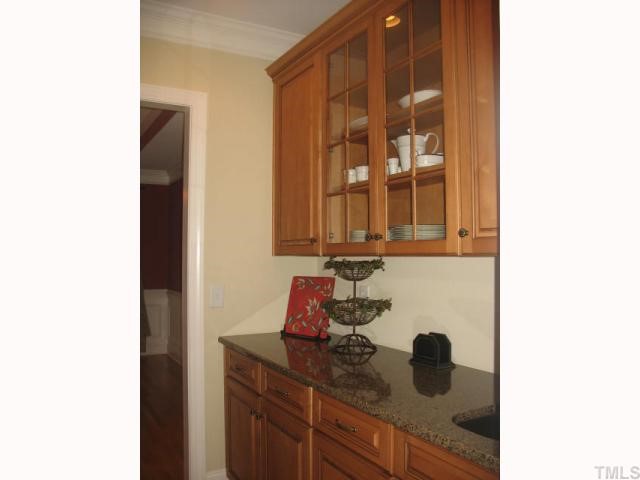 10311 Evergreen Spring Place Raleigh, NC 27614 - Photo 4 of 12 This butler's pantry is located between the kitchen and dining room. It also has a sink - perfect for preparation and or a buffet.