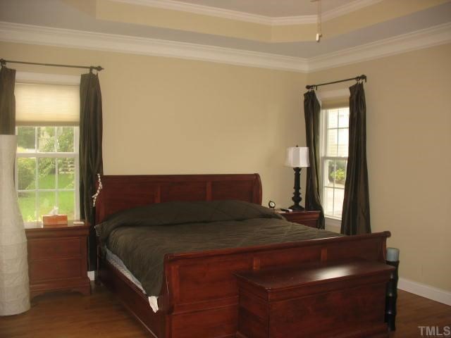 10311 Evergreen Spring Place Raleigh, NC 27614 - Photo 6 of 12 Located on the first floor, this large master suite has hardwood flooring, a trey ceiling and ceiling fan. It is a private oasis at the rear of the home.