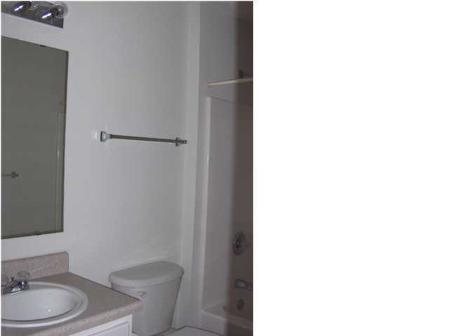 133 Sandstone Trail Crestview, FL 32539 - Photo 7 of 9 a bathroom with a granite countertop toilet and a sink