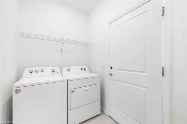 a view of storage and utility room with washer and dryer