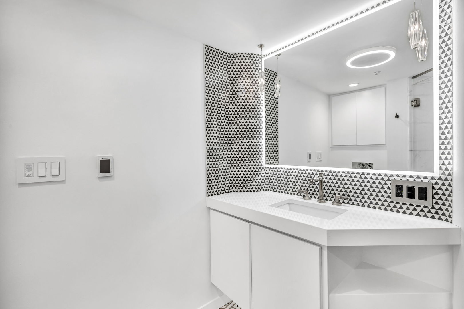 801 South Wells Street, Unit 101 Chicago, IL 60607 - Photo 20 of 33 a bathroom with a sink and a mirror