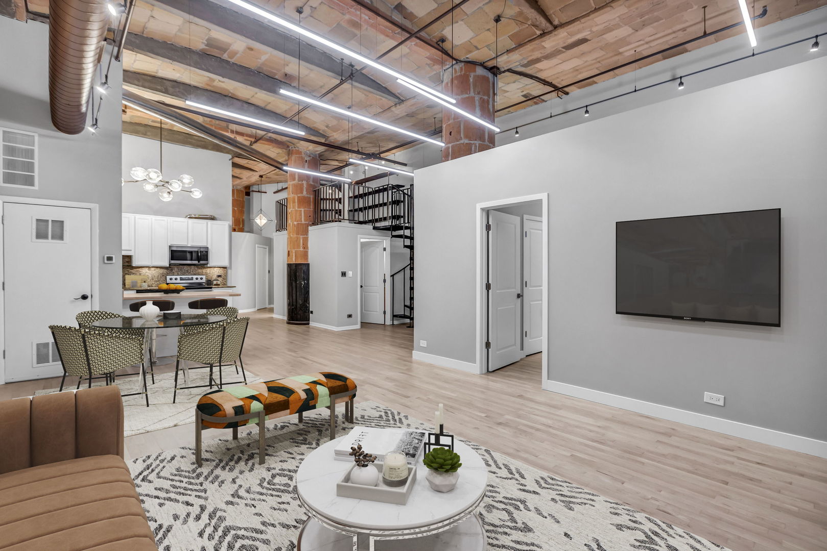 801 South Wells Street, Unit 101 Chicago, IL 60607 - Photo 2 of 33 a living room with furniture and a flat screen tv