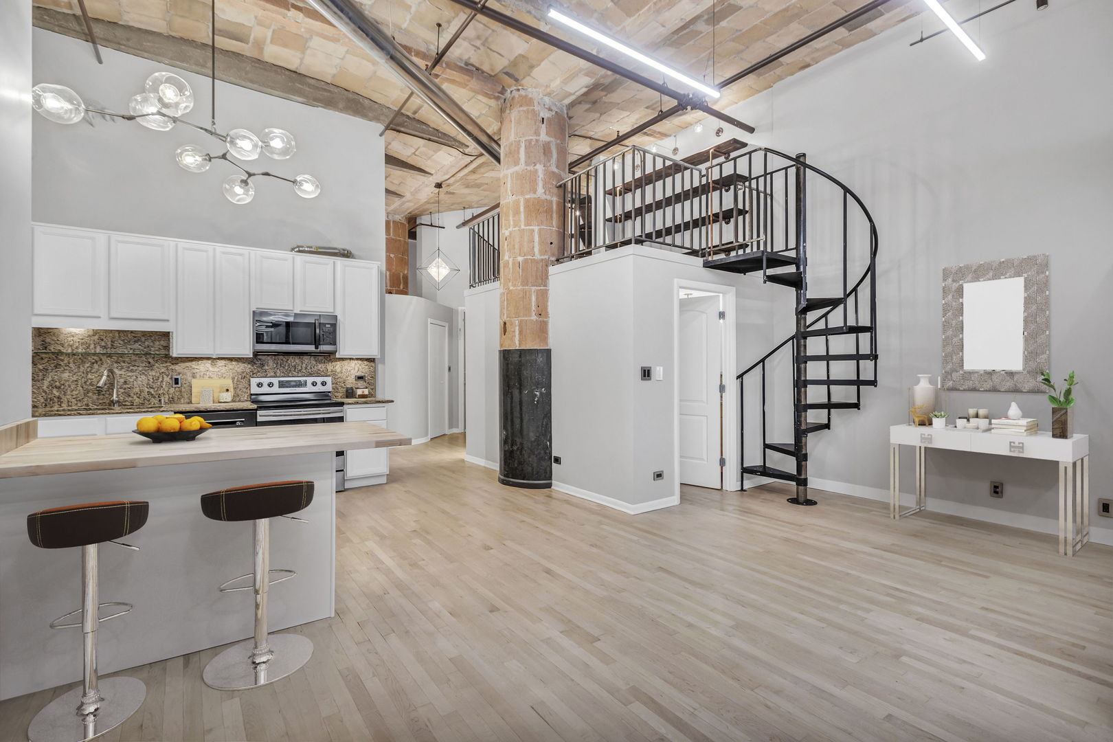 801 South Wells Street, Unit 101 Chicago, IL 60607 - Photo 4 of 33 a view of kitchen with furniture and wooden floor