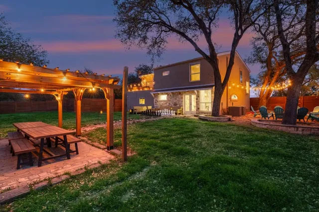 a view of a chairs and tables in the yard
