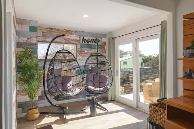 a bedroom with furniture and a window